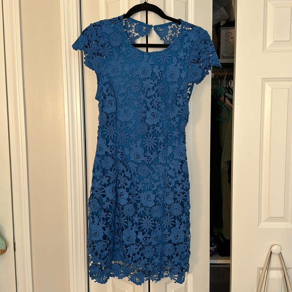 Lulu’s “Romance Language Blue Backless Lace Dress”